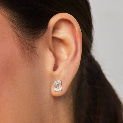 AGI Certified lab-grown emerald cut diamond stud earrings in 14K white gold, showcasing sparkling gemstones and elegant design