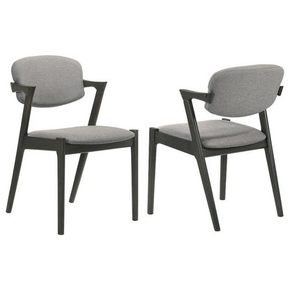 Pair of Start2Finish Stevie padded wood dining arm chairs in black with cushioned seats and curved armrests.