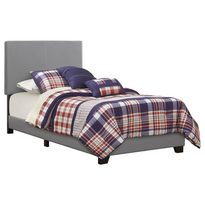 Grey upholstered twin panel bed by Start2Finish with a modern design and padded headboard, perfect for a contemporary bedroom.