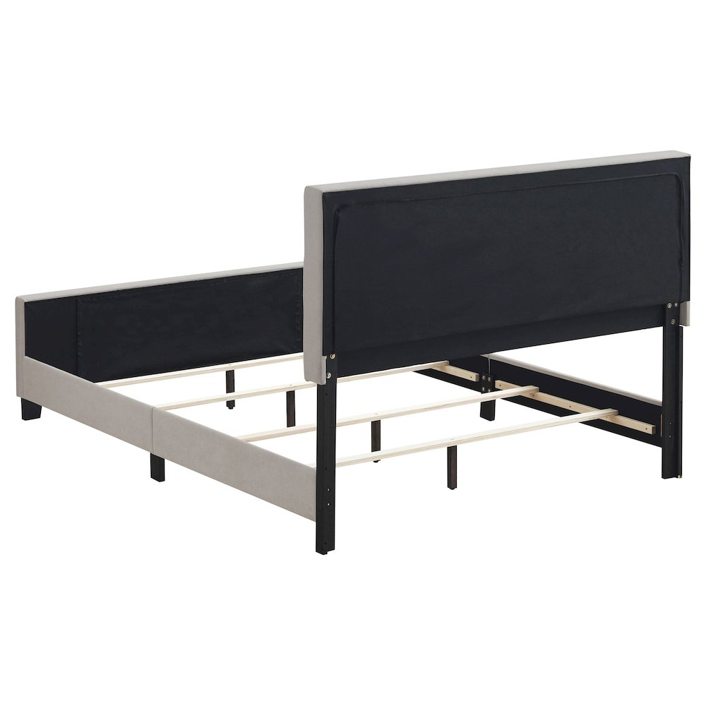 Beige upholstered Fairfield queen panel bed by Start2Finish, showcasing the headboard and sleek furniture design.