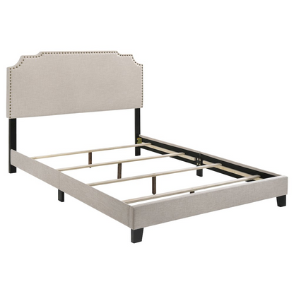 Start2Finish Tamarac upholstered full panel bed in beige with padded headboard and sleek wooden frame.