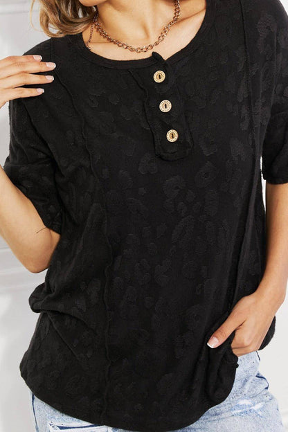 Black BOMBOM At The Fair Animal Textured T-shirt by Carmine Juneberry featuring a playful animal print design.