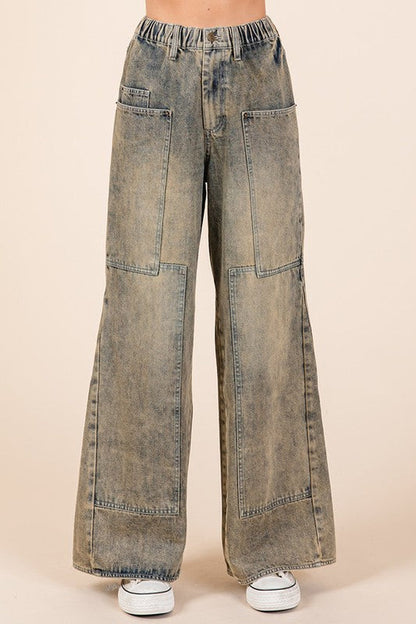 Jade Icarus Mittoshop washed wide-leg jeans with pockets, showcasing distressed denim and relaxed fit on a model.