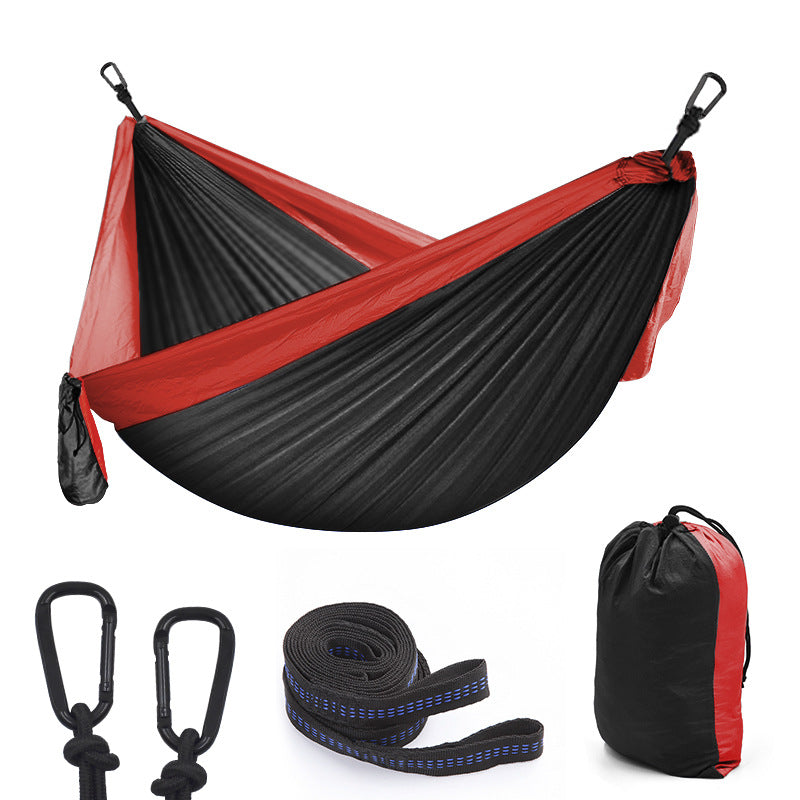 Maroon Asteria camping parachute hammock for outdoor survival and garden relaxation, lightweight and durable for outdoor adventures.