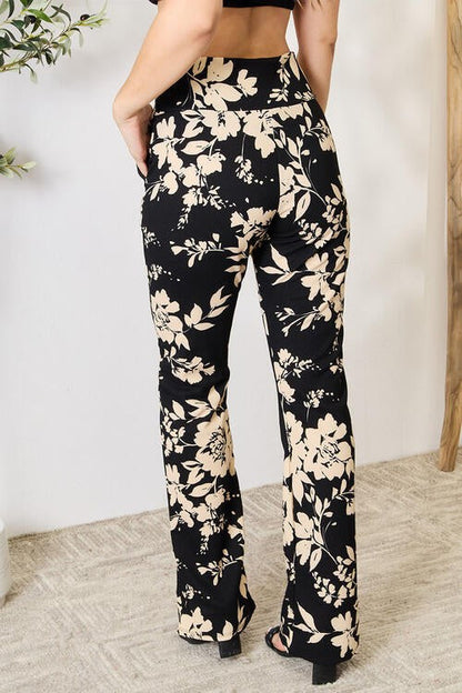 Jade Icarus Heidi Flare Pants in denim with high waist and flared leg, styled with casual top on a model.