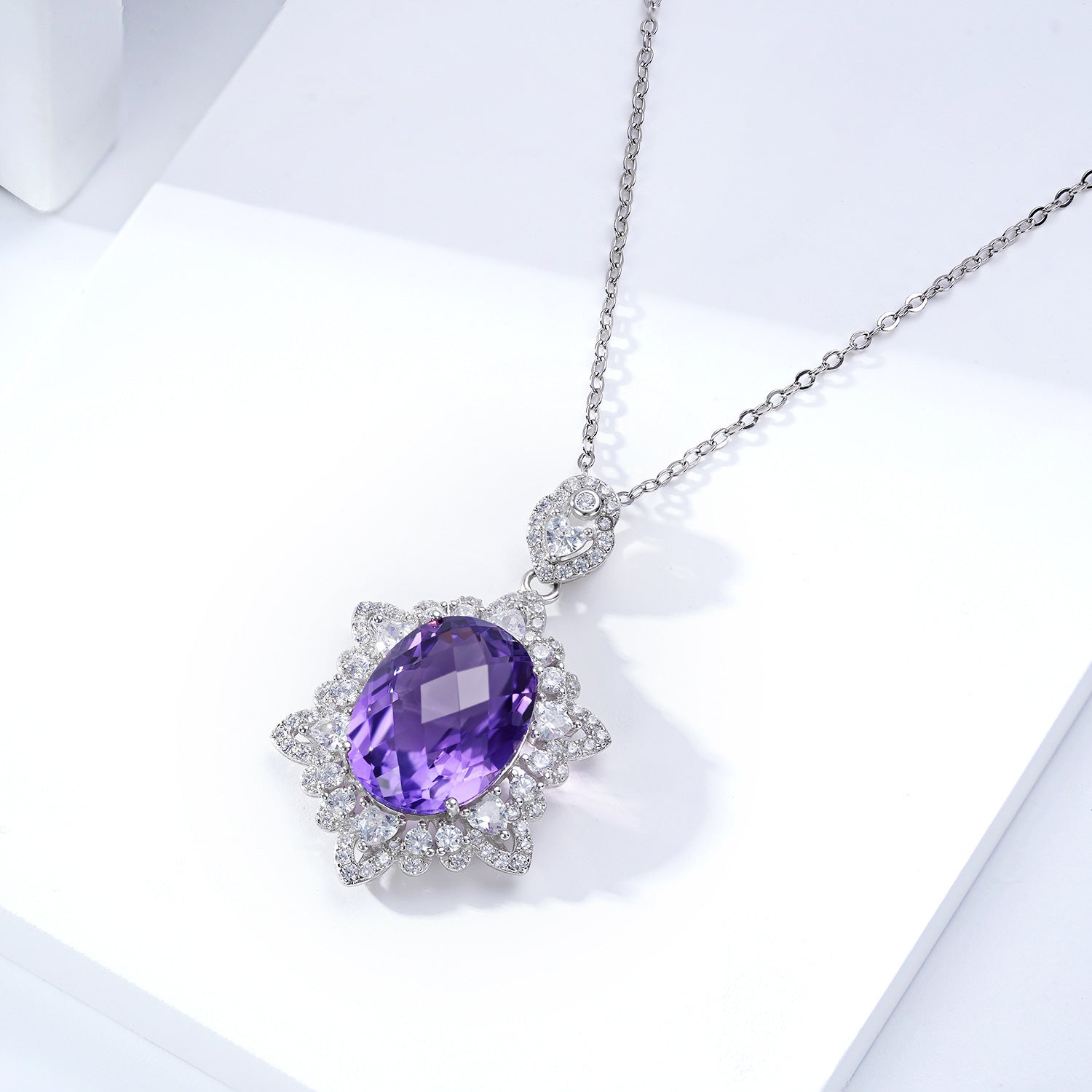 Carmine Juneberry LuxeJewels Amélys Clarity Pendant necklace featuring a sparkling gemstone on a delicate chain.