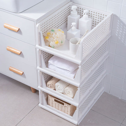 Four stackable Pear Daisy plastic storage boxes with slide rails, ideal for organizing living room or home storage.