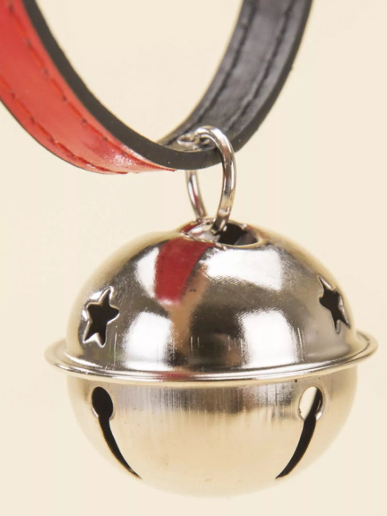 Leather pet collar with bell from Pear Daisy, featuring durable leather and a small metal bell for pets.