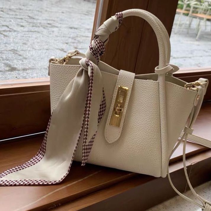 Carmine Juneberry CityEdit™ Litchi Luxe Tote with scarf handle, stylish tote bag with textured litchi pattern and decorative scarf accent.