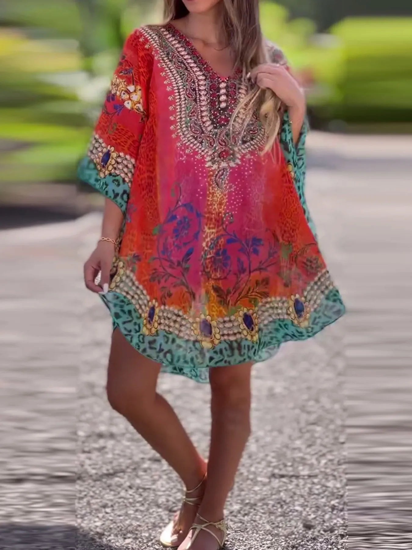 Floral print V-neck cover-up by Carmine Juneberry, lightweight fabric with vibrant floral design, perfect for beach or poolside.