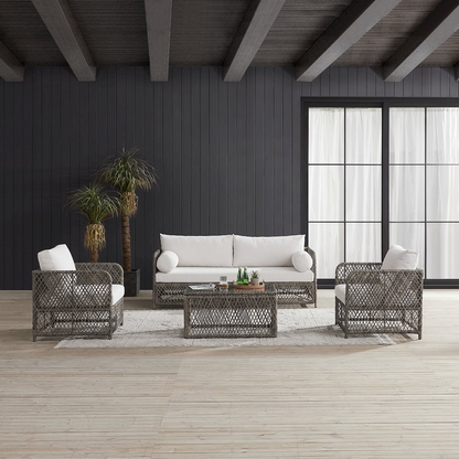 Granite Bay 4-piece outdoor sofa patio furniture set by Start2Finish with a sofa, coffee table, and two chairs on a patio.