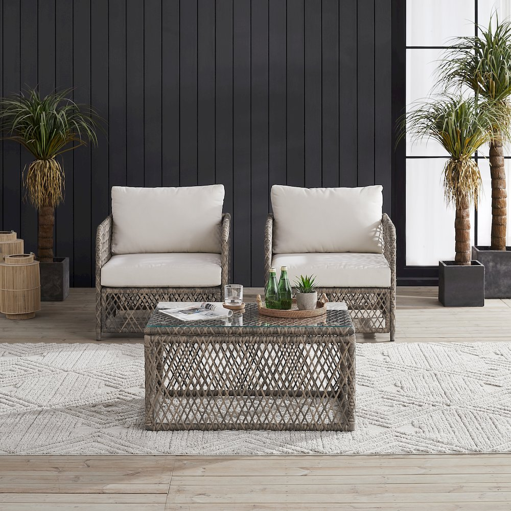 Granite Bay 3-piece wicker outdoor chair set with two chairs and a coffee table, featuring cushioned seats and natural rattan design.