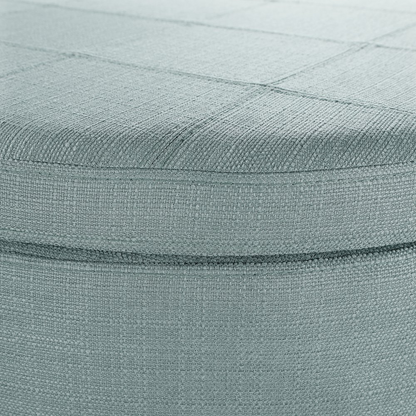 Start2Finish Alloway storage ottoman in Sea Blue fabric with antique bronze nailhead detailing, showing its cushioned top and stylish design.