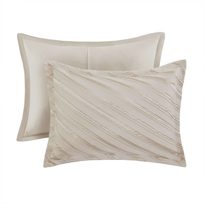 Start2Finish Riva 7-piece beige comforter set with matching pillow shams and decorative cushions on a bed.
