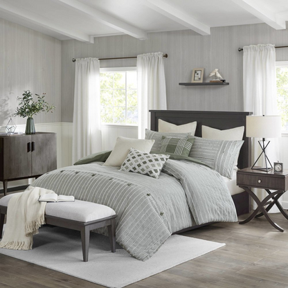 Oversized cotton comforter set with euro shams and throw pillows, featuring soft, breathable fabric and cozy bedding design.
