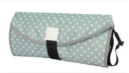 Soft baby changing pad from CJDropshipping, featuring a cushioned surface and secure sides for comfortable diaper changes.