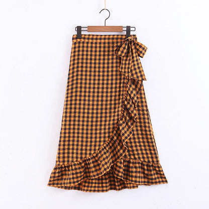 Yellow plaid ruffle midi skirt for women by Jade, high waist design with bow detail, stylish and elegant high fashion clothing.