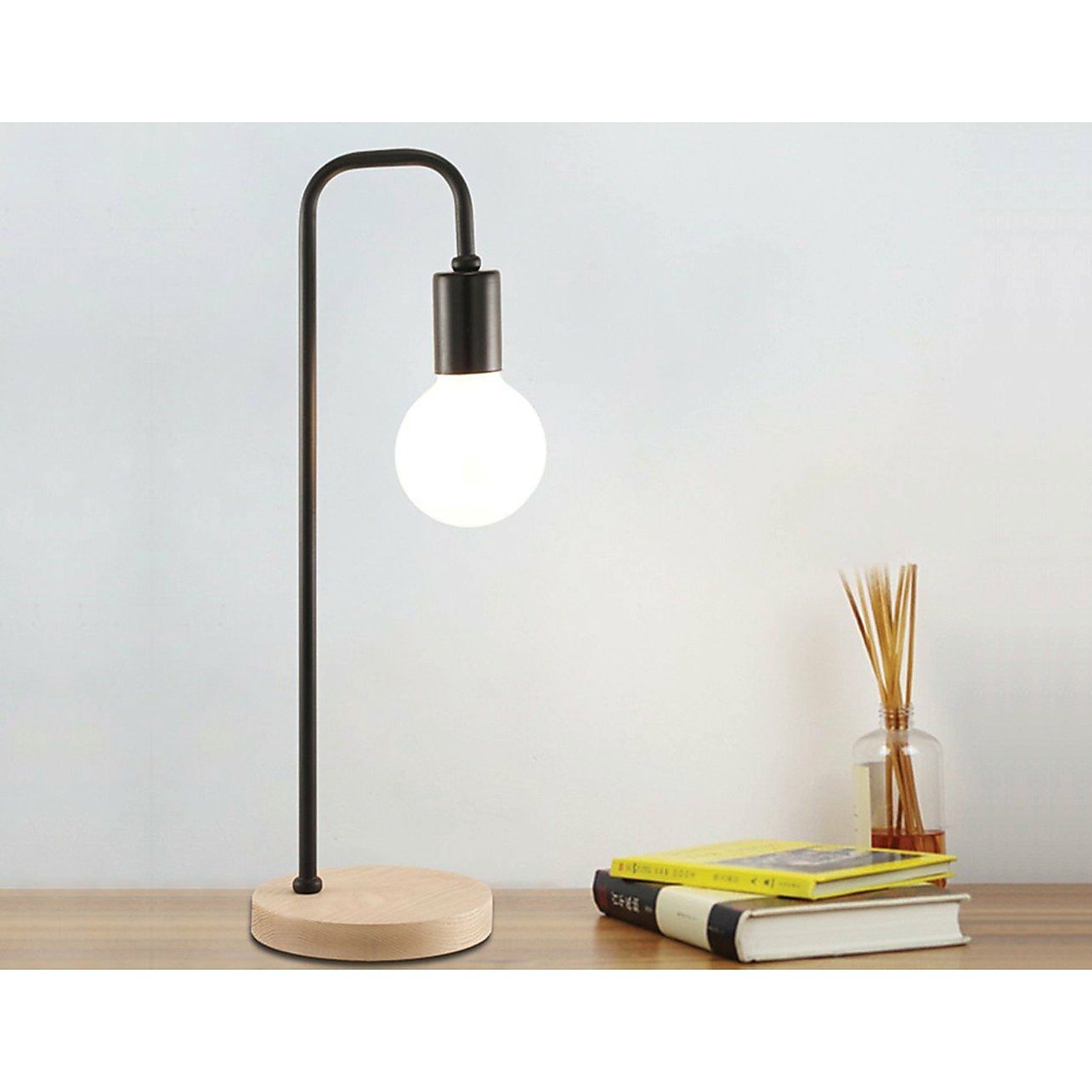Modern black table lamp with timber base, Magenta Danae desk light for bedside or bedroom decor, featuring a sleek, contemporary design.