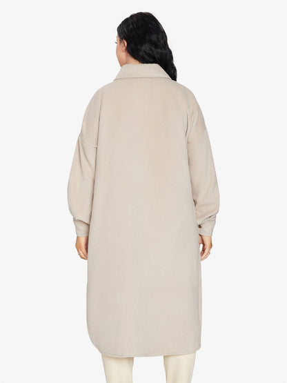 Rose Eleusis oversized longline shacket in neutral fabric, featuring a relaxed fit, button closure, and side pockets.