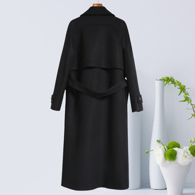 Black silhouette overcoat from Carmine Juneberry Haute Edition 25, stylish jacket with a sleek, fitted design.