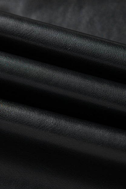 Black solid faux leather side slit maxi skirt for women by Byzantium Bay, featuring a flowing design and side slit detail.