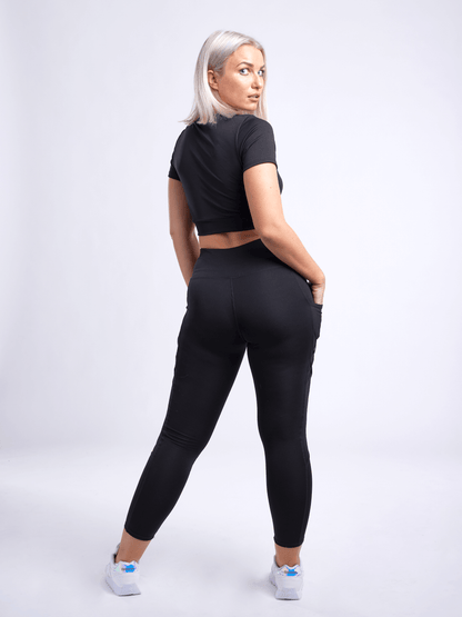 Black Lavender JupiterGear short-sleeve crop top, activewear with a fitted design, displayed on a neutral background.