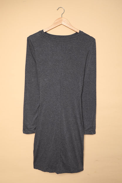 Gray long sleeve cut-out twist ruched bodycon mini dress by Harlequin Daisy, showcasing fitted design and stylish details.