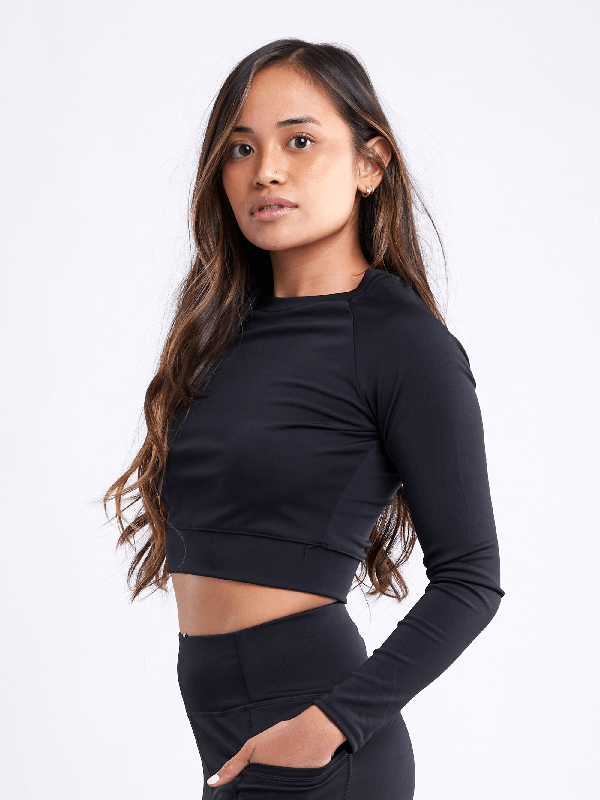 Black Lavender JupiterGear long-sleeve crop top in activewear, shown on a model, featuring a fitted design and stylish stretch fabric.