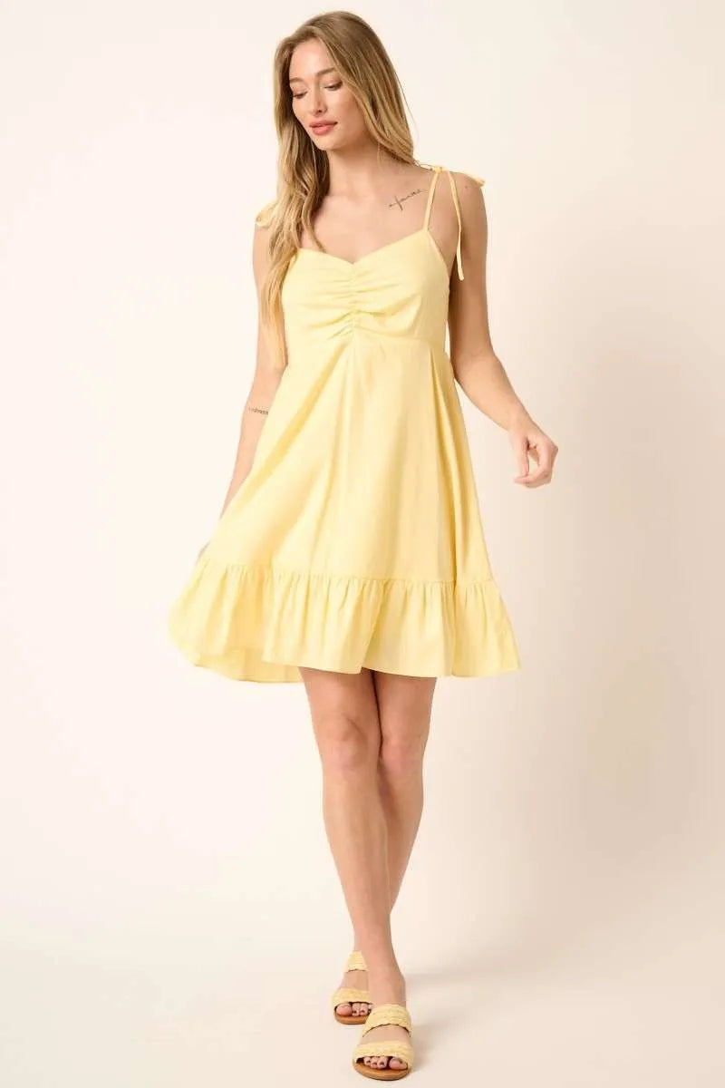 Automotive image showing a Jade Icarus Mittoshop Ruched Detail Spaghetti Tie Mini Dress with ruched accents and spaghetti straps.