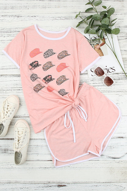 Pink leopard print short sleeve T-shirt and drawstring shorts set by Harlequin Daisy, casual bath and beauty loungewear ensemble.