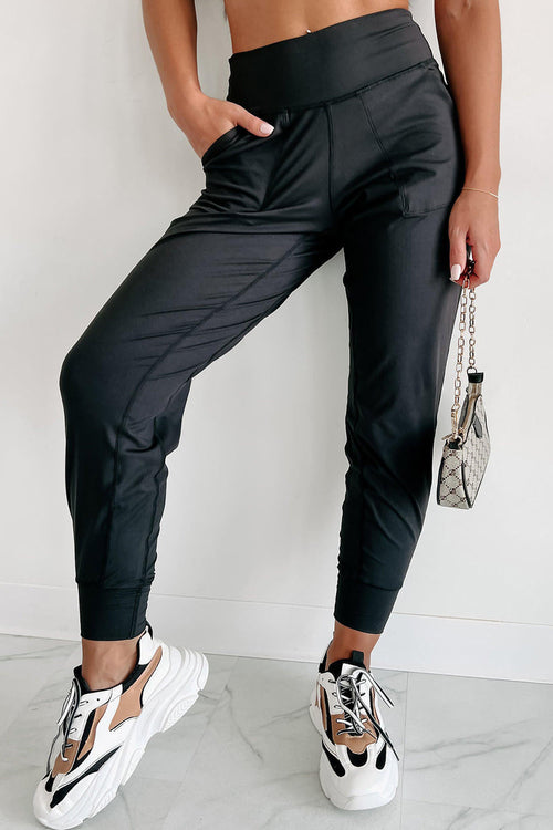 Black exposed seam high waist joggers with pockets from Carmine Juneberry, showcasing a stylish and comfortable gift option.