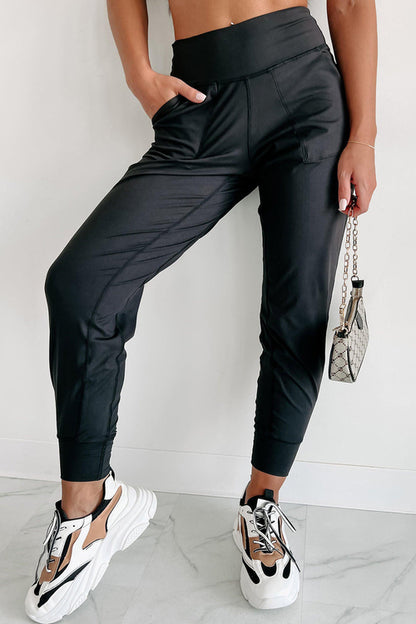 Black exposed seam high waist joggers with pockets from Carmine Juneberry, showcasing a stylish and comfortable gift option.