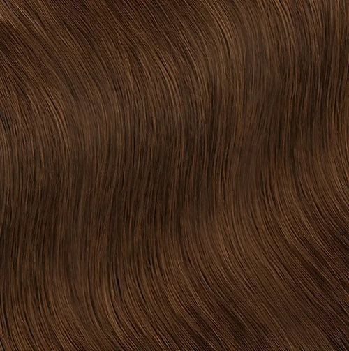Light brown short human hair wig with loose curls by Peach Clymene, showcasing soft, natural-looking curly hair style.