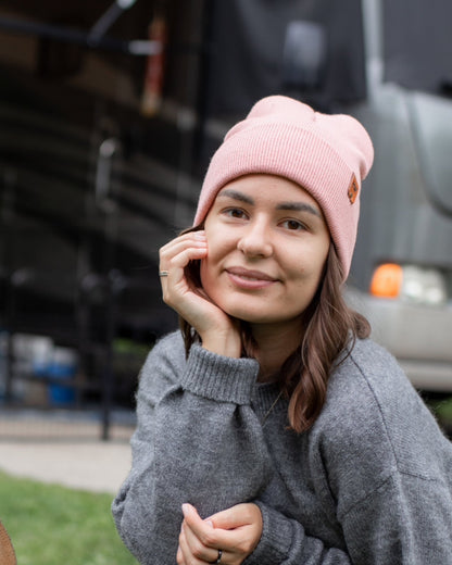 Azure Arrowwood HAAKWEAR knit cuffed beanie in pearl pink, showing the cozy, ribbed knit hat with cuff detail and soft texture.