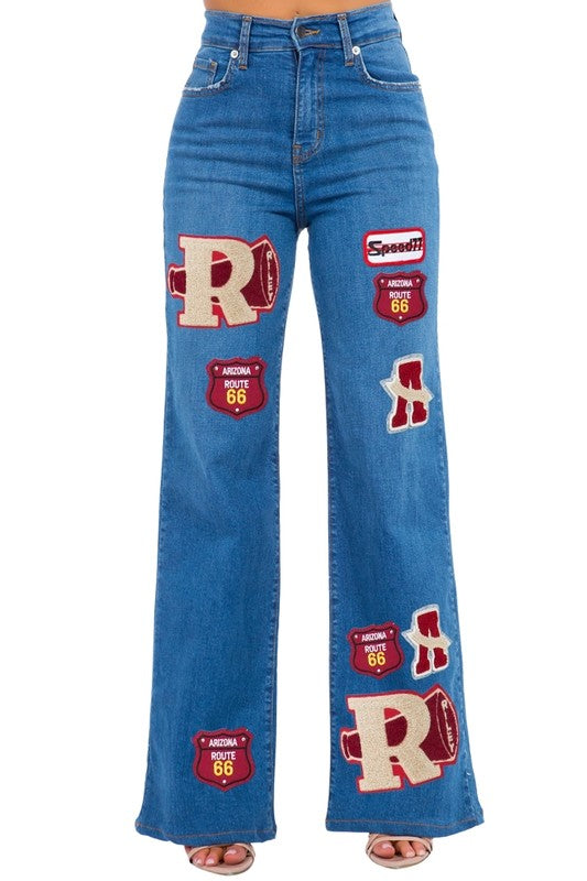 Jade Icarus Varsity Wide Leg Jean in medium blue denim, featuring a relaxed fit and classic jean styling.