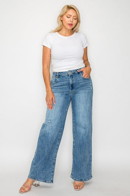 Jade Icarus bytos full size high rise wide-leg jeans with pockets, shown on a woman, in a natural denim wash.