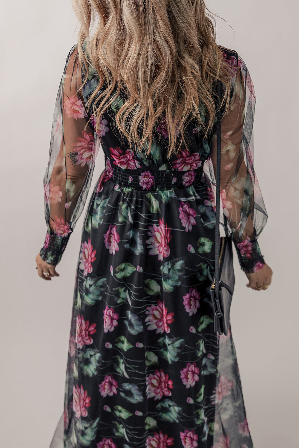 Black mesh sheer shirred high waist floral maxi dress by Harlequin Daisy, featuring a flowing design with floral patterns and high waist detail.