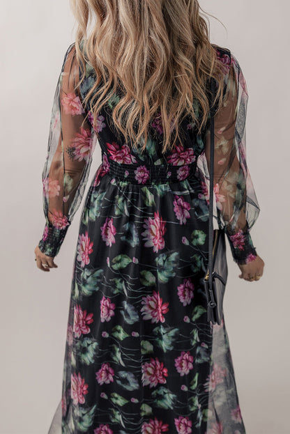 Black mesh sheer shirred high waist floral maxi dress by Harlequin Daisy, featuring a flowing design with floral patterns and high waist detail.