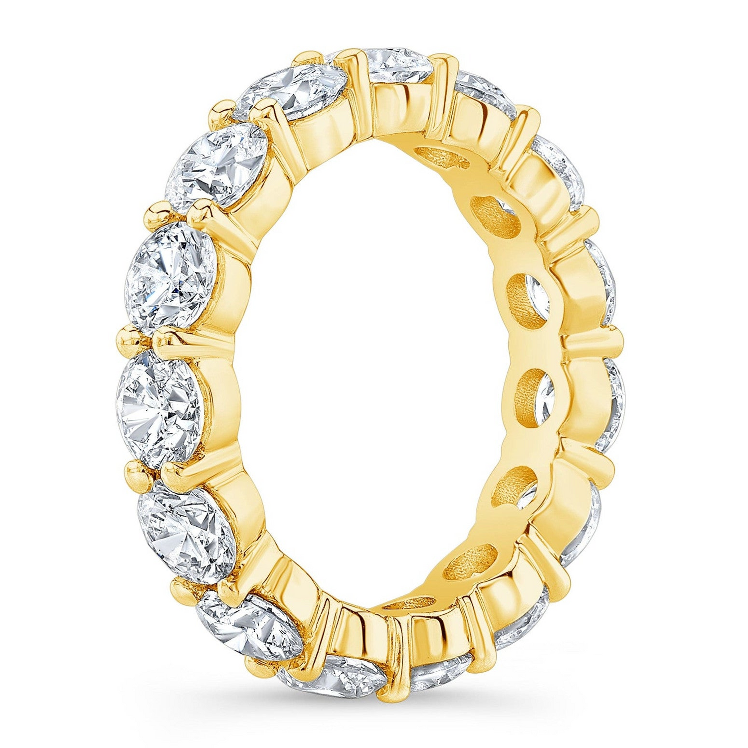 Round cut 4.00 Ct created moissanite eternity band in 14k gold overlay, showcasing sparkling gemstones and a continuous design.