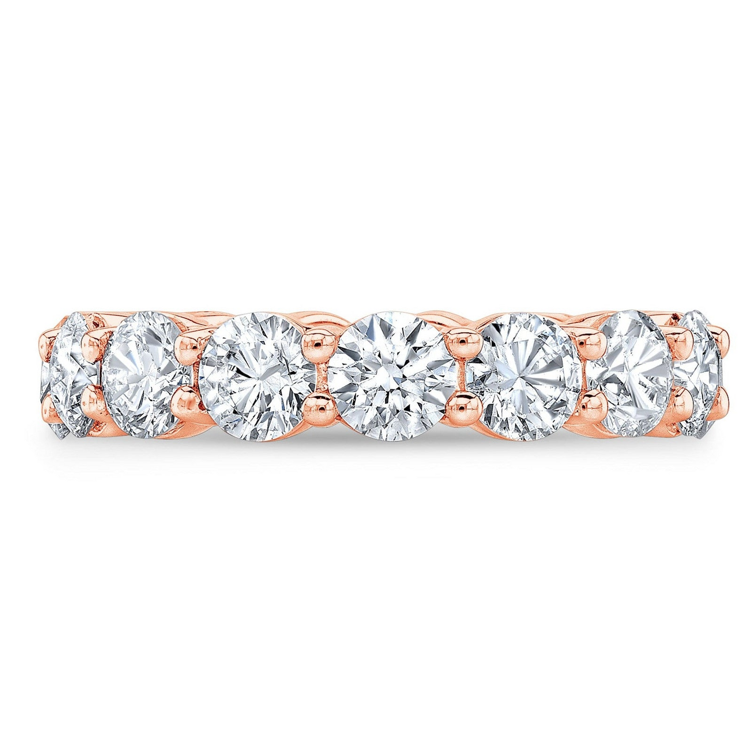 Round cut 4.00 Ct created moissanite eternity band in 14k gold overlay, featuring a continuous row of sparkling gemstones.