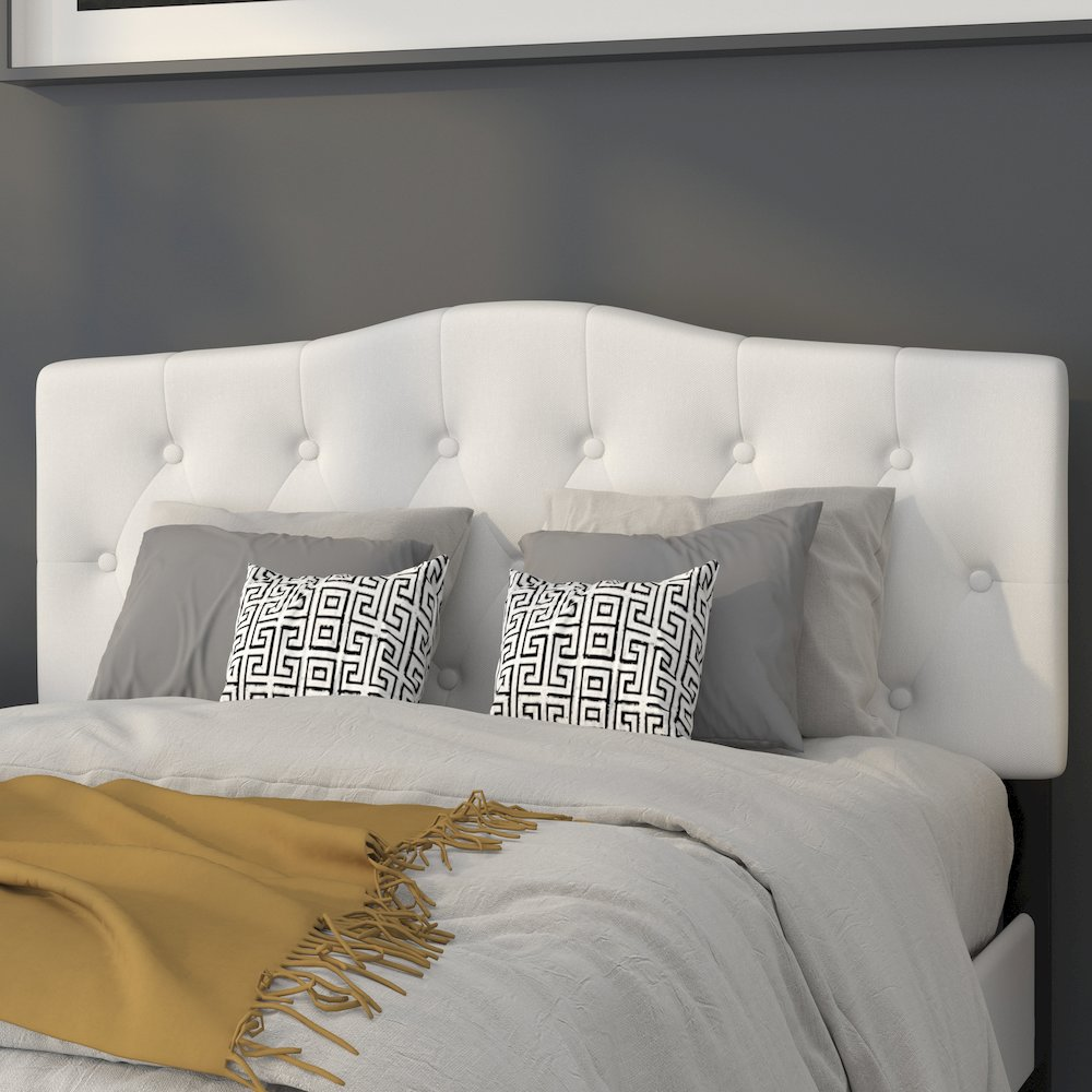 White tufted upholstered full size headboard in fabric, featuring a plush, padded design with nailhead trim for a stylish bedroom accent.