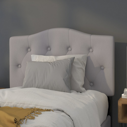 Light gray tufted upholstered twin size headboard in fabric with button detailing, designed for a modern bedroom.