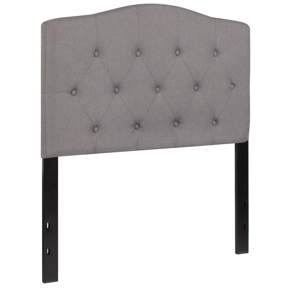 Light gray tufted upholstered twin size headboard in fabric, featuring plush tufted design for a cozy bedroom look.