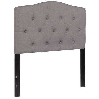 Light gray tufted upholstered twin size headboard in fabric, featuring plush tufted design for a cozy bedroom look.