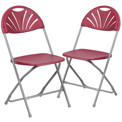 Two burgundy plastic folding chairs with fan back design, 650 lb. capacity, by Start2Finish, shown folded for easy storage.