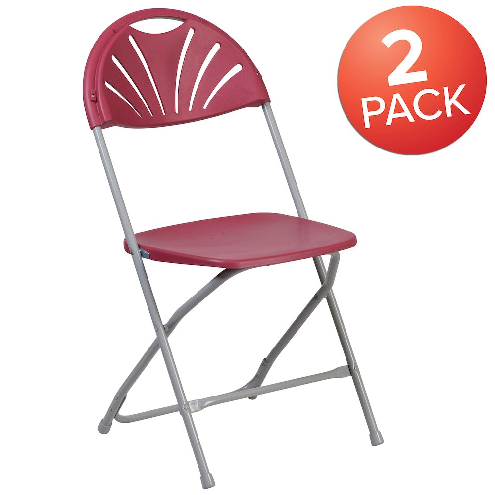 Two Burgundy HERCULES Series plastic folding chairs with fan back design, 650 lb. capacity, by Start2Finish, shown folded for storage.