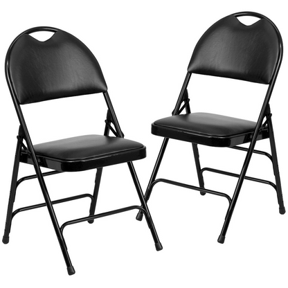 Two black vinyl folding chairs with triple-braced metal frames and easy-carry handles, part of the HERCULES Series by Start2Finish.