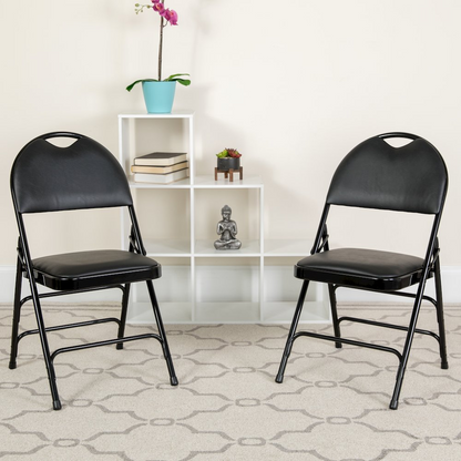 Two black vinyl folding chairs from Start2Finish Hercules Series with triple-braced metal frames and easy-carry handles