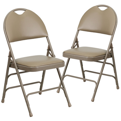 Two beige HERCULES Series vinyl metal folding chairs with triple-braced frames and easy-carry handles, ideal for portable seating.