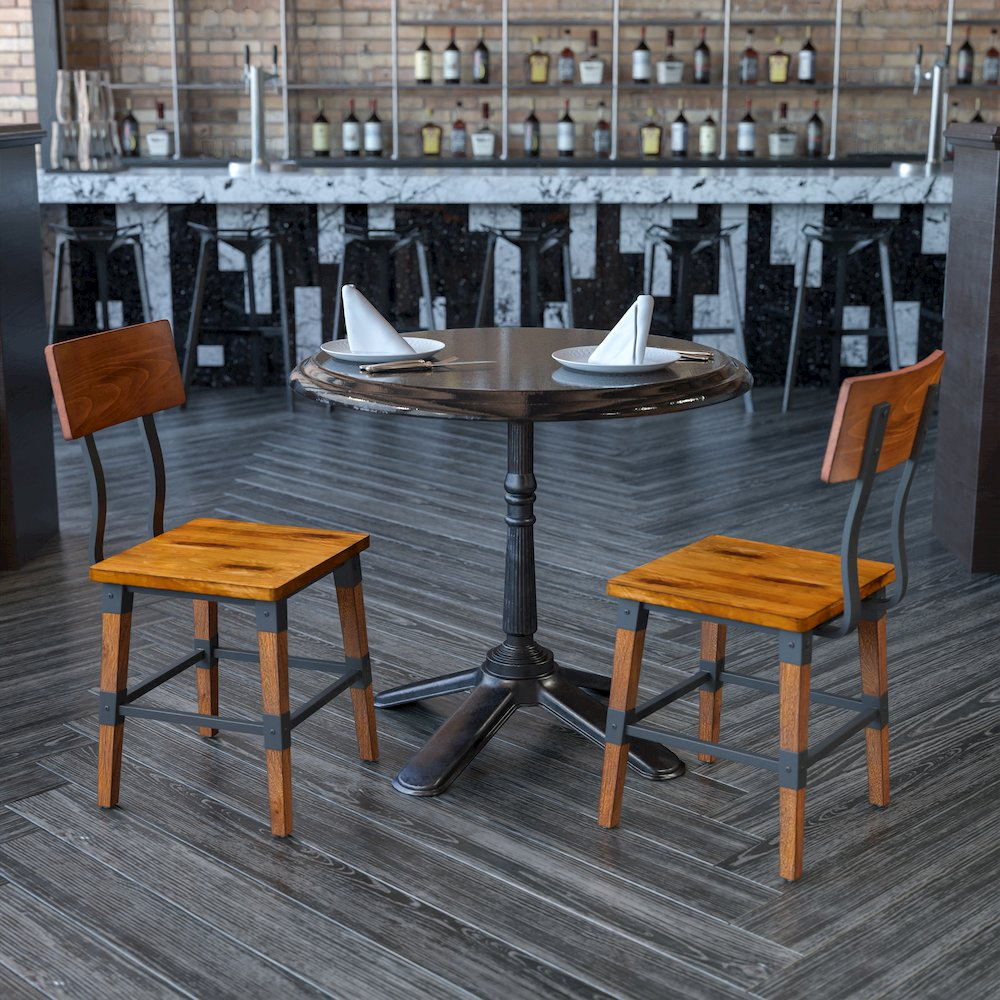 Set of two rustic antique walnut industrial wood dining chairs with metal accents, perfect for farmhouse or industrial-style dining rooms.